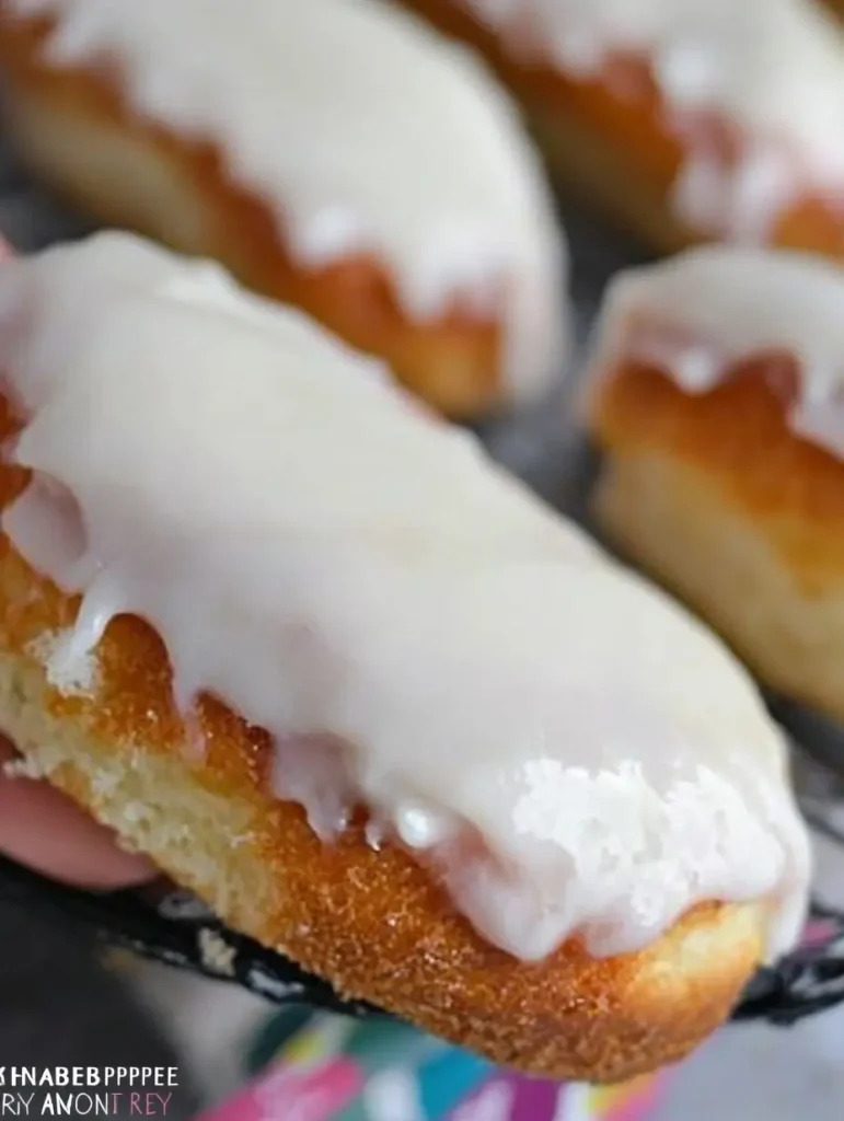 Thick icing spread over gluten-free iced buns