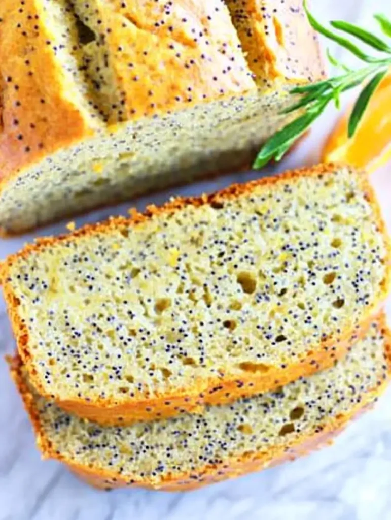 Freshly baked Orange Poppy Seed Bread with a golden crust.