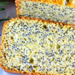 Golden gluten-free Orange Poppy Seed Bread with visible poppy seeds and orange zest